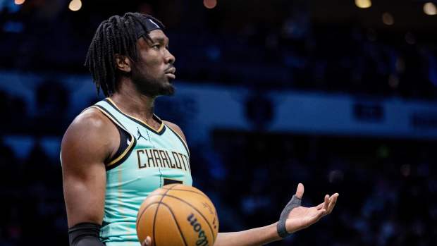 Charlotte, North Carolina, USA; Charlotte Hornets center Mark Williams (5) reacts after a foul against the Portland Trail Blazers during the third quarter at Spectrum Center. Mandatory Credit: Scott Kinser-Imagn Images