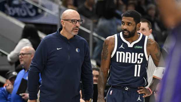 Dallas Mavericks head coach Jason Kidd talks with guard Kyrie Irving (11) during the first quarter against the Sacramento Kings at the American Airlines Center. Mandatory Credit: Jerome Miron-Imagn Images