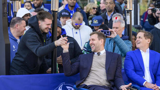 Dec 25, 2022; Dallas, Texas, USA; (from left) Dallas Mavericks guard Luka Doncic and former player Dirk Nowitzki and Mavericks owner Mark Cuban during the ceremony for the unveiling of a statue of Nowitzki before the game between the Dallas Mavericks and the Los Angeles Lakers American Airlines Center . Mandatory Credit: Jerome Miron-Imagn Images