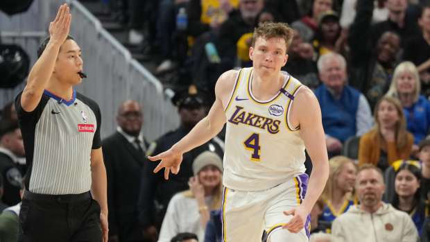 Los Angeles Lakers guard Dalton Knecht (4) gestures after making a three point basket against the Golden State Warriors during the third quarter at Chase Center. Mandatory Credit: Darren Yamashita-Imagn Images