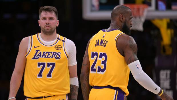 Los Angeles, California, USA; Los Angeles Lakers guard Luka Doncic (77) and forward LeBron James (23) on the court in the first half against the Utah Jazz at Crypto.com Arena. Mandatory Credit: Jayne Kamin-Oncea-Imagn Images