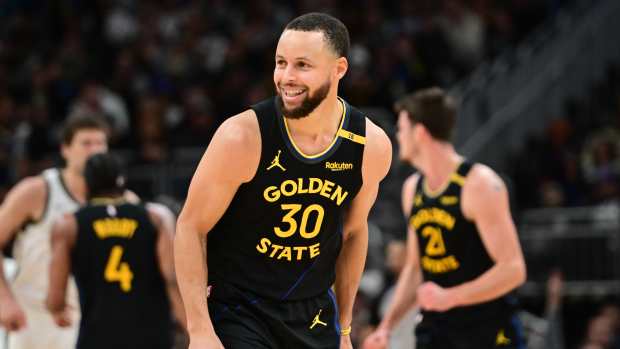 Feb 10, 2025; Milwaukee, Wisconsin, USA; Golden State Warriors guard Stephen Curry (30) reacts in the fourth quarter against the Milwaukee Bucks at Fiserv Forum. Mandatory Credit: Benny Sieu-Imagn Images  