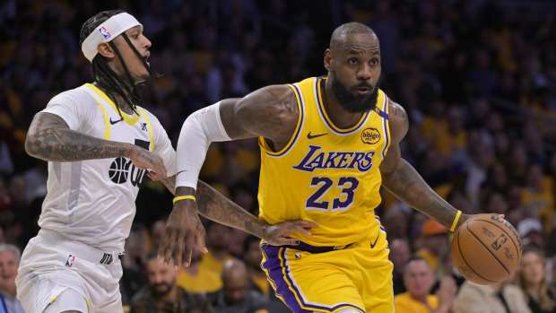 Los Angeles Lakers forward LeBron James (23) drives past Utah Jazz guard Jordan Clarkson (00) in the first half at Crypto.com Arena.