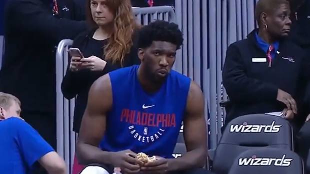 Joel Embiid eating burgers before a game