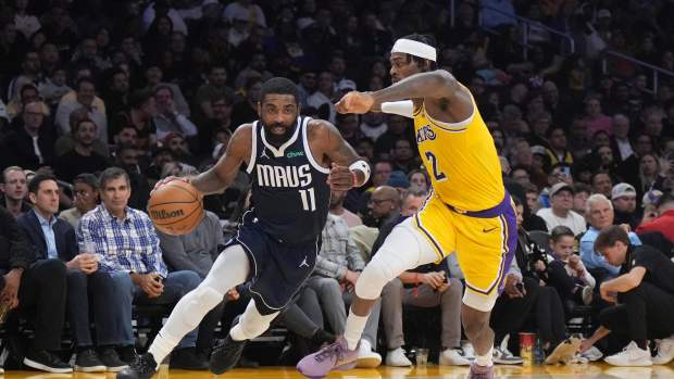 Dallas Mavericks guard Kyrie Irving (11) dribbles the ball against Los Angeles Lakers forward Jarred Vanderbilt (2) in the first half at Crypto.com Arena. Mandatory Credit: Kirby Lee-Imagn Images