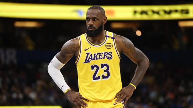 Orlando, Florida, USA; Los Angeles Lakers forward LeBron James (23) looks on against the Orlando Magic in the second quarter at Kia Center. Mandatory Credit: Nathan Ray Seebeck-Imagn Images