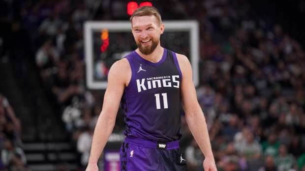 Sacramento Kings center Domantas Sabonis (11) smiles after a timeout against the Boston Celtics in the second quarter at the Golden 1 Center. Mandatory Credit: Cary Edmondson-Imagn Images