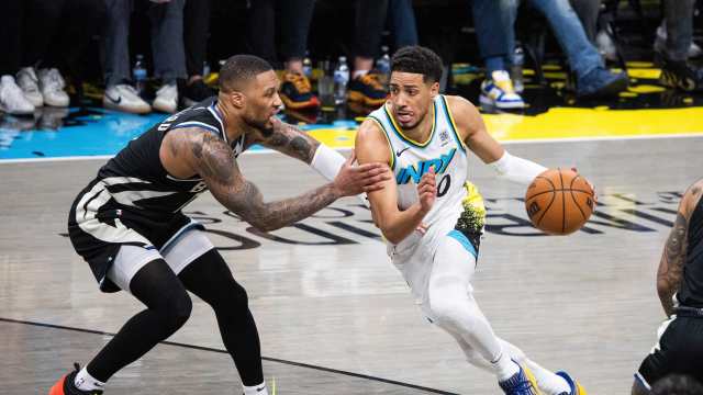 Indianapolis, Indiana, USA; Indiana Pacers guard Tyrese Haliburton (0) dribbles the ball while Milwaukee Bucks guard Damian Lillard (0) defends during game two of first round for the 2024 NBA Playoffs at Gainbridge Fieldhouse. Mandatory Credit: Trevor Ruszkowski-Imagn Images