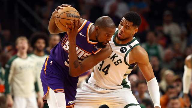 Mar 24, 2025; Phoenix, Arizona, USA; Milwaukee Bucks forward Giannis Antetokounmpo (34) defends against Phoenix Suns forward Kevin Durant (35) at Footprint Center.
