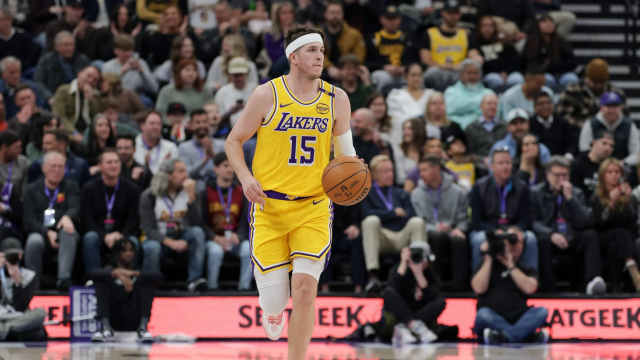 Los Angeles Lakers guard Austin Reaves (15) dribbles against the Utah Jazz during the first quarter at Delta Center.