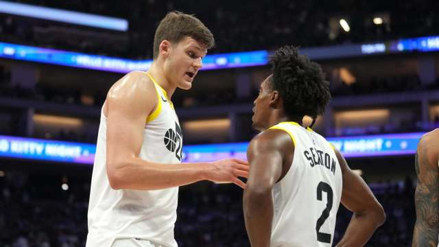 Mar 31, 2024; Sacramento, California, USA; Utah Jazz center Walker Kessler (left) talks with guard Collin Sexton (2) during halftime against the Sacramento Kings at Golden 1 Center. Mandatory Credit: Darren Yamashita-Imagn Images 