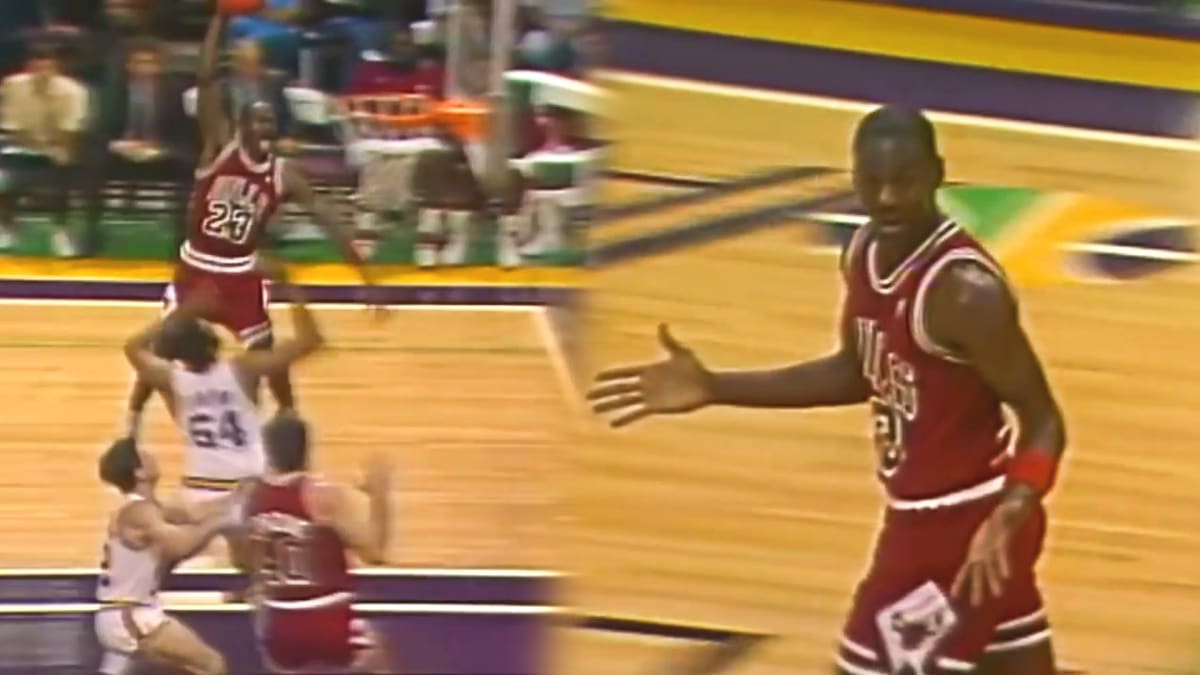 John Stockton of the Utah Jazz attempts a layup against Michael