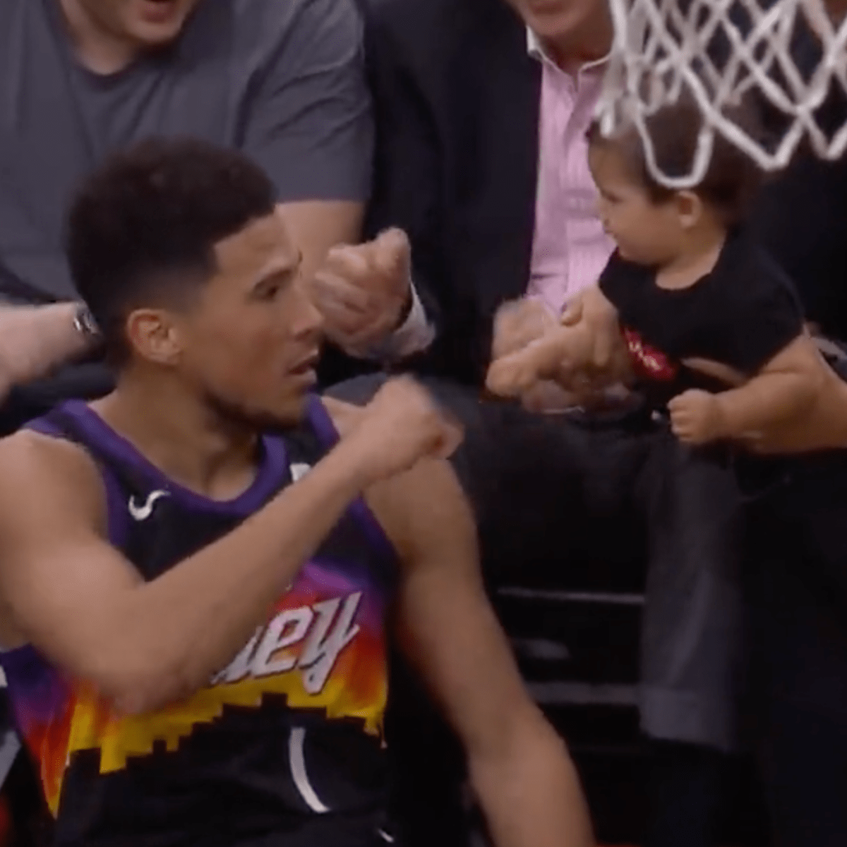 Suns SG Devin Booker fist bumps baby in epic moment after heat check bucket