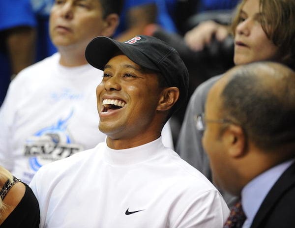 Golfer Tiger Woods and his wife Elin Nordegren (L) attend Game 4 of the NBA final between the Orlando Magic and Los Angeles Lakers June 11, 2009 at Amway Arena in Orlando, Florida. AFP PHOTO/Stan Honda (Photo credit should read STAN HONDA/AFP/Getty Images)