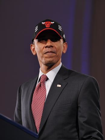 US President Barack Obama wears a Chicago Bulls cap after speaking at a DNC fundraiser April 14, 2011 at the Navy Pier in Chicago. Obama is in Chicago to attend a series of DNC fundraisers. AFP PHOTO/Mandel NGAN (Photo credit should read MANDEL NGAN/AFP/GettyImages)