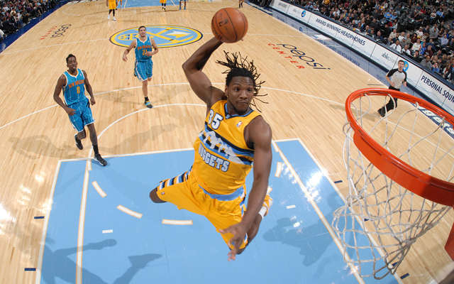 DENVER, CO - NOVEMBER 25: Kenneth Faried #35 of the Denver Nuggets goes to the basket during the game between the New Orleans Hornets and the Denver Nuggets on November 25, 2012 at the Pepsi Center in Denver, Colorado. NOTE TO USER: User expressly acknowledges and agrees that, by downloading and/or using this Photograph, user is consenting to the terms and conditions of the Getty Images License Agreement. Mandatory Copyright Notice: Copyright 2012 NBAE (Photo by Garrett W. Ellwood/NBAE via Getty Images)