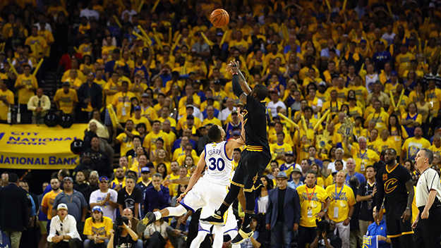 OAKLAND, CA - JUNE 19: Kyrie Irving #2 of the Cleveland Cavaliers shoots a three-point basket late in the fourth quarter against Stephen Curry #30 of the Golden State Warriors in Game 7 of the 2016 NBA Finals at ORACLE Arena on June 19, 2016 in Oakland, California. NOTE TO USER: User expressly acknowledges and agrees that, by downloading and or using this photograph, User is consenting to the terms and conditions of the Getty Images License Agreement. (Photo by Ezra Shaw/Getty Images)