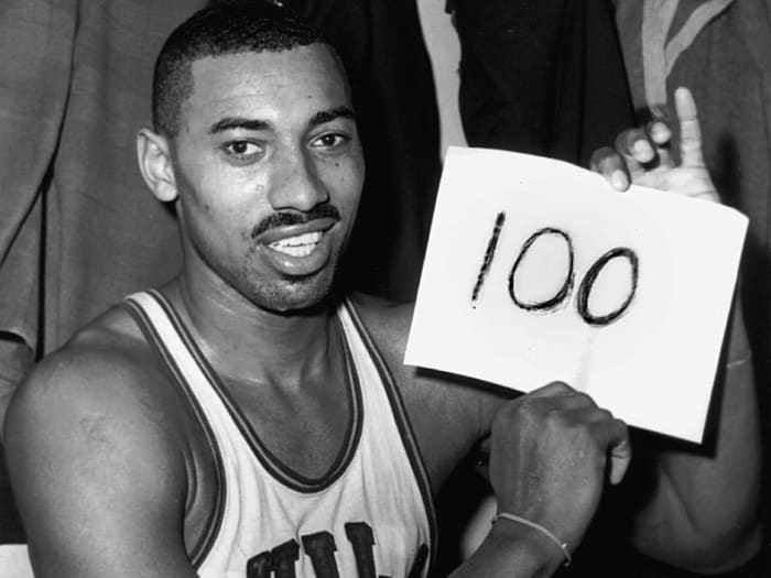 Wilt Chamberlain of the Philadelphia Warriors poses in the dressing room after he scored 100 points in a game against the New York Knickerbockers on March 2, 1962.
