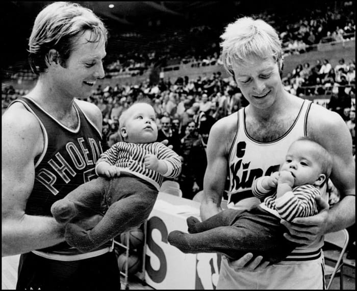 Twin brother professional basketball players (left, Suns) Dick Van Arsdale and (Kings) Tom Van Arsdale at the City Auditorium. Dick is holding 8 month old Greg Combs and Tom is holding Greg's twin brother Gary. Twins were admitted free. 1/7/1973
