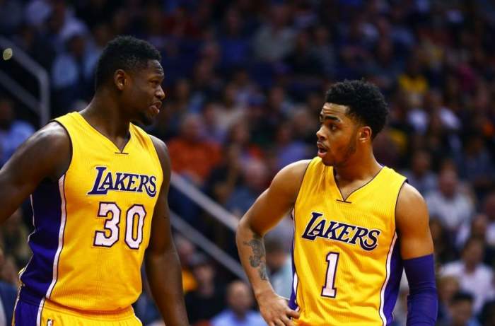 Mar 23, 2016; Phoenix, AZ, USA; Los Angeles Lakers forward Julius Randle (30) and guard D'Angelo Russell (1) against the Phoenix Suns at Talking Stick Resort Arena. The Suns defeated the Lakers 119-107. Mandatory Credit: Mark J. Rebilas-USA TODAY Sports