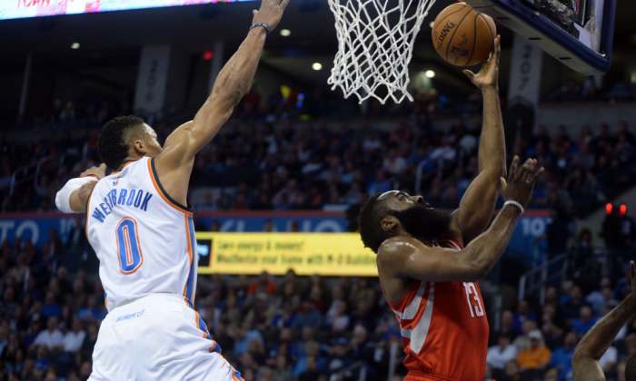 Jan 29, 2016; Oklahoma City, OK, USA; Oklahoma City Thunder guard Russell Westbrook (0) blocks a shot attempt by Houston Rockets guard James Harden (13) ;f1q; at Chesapeake Energy Arena. Mandatory Credit: Mark D. Smith-USA TODAY Sports ORG XMIT: USATSI-232696 ORIG FILE ID: 20160129_pjc_ax3_042.JPG