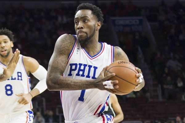 Dec 7, 2015; Philadelphia, PA, USA; Philadelphia 76ers guard Tony Wroten (1) drives against San Antonio Spurs center Boris Diaw (33) during the first quarter at Wells Fargo Center. Mandatory Credit: Bill Streicher-USA TODAY Sports