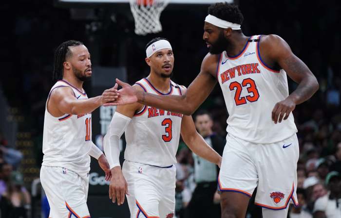 New York Knicks guard Jalen Brunson (11) and center Mitchell Robinson (23) react after a play against the Boston Celtics in the second half during game two of the second round for the 2025 NBA Playoffs at TD Garden.