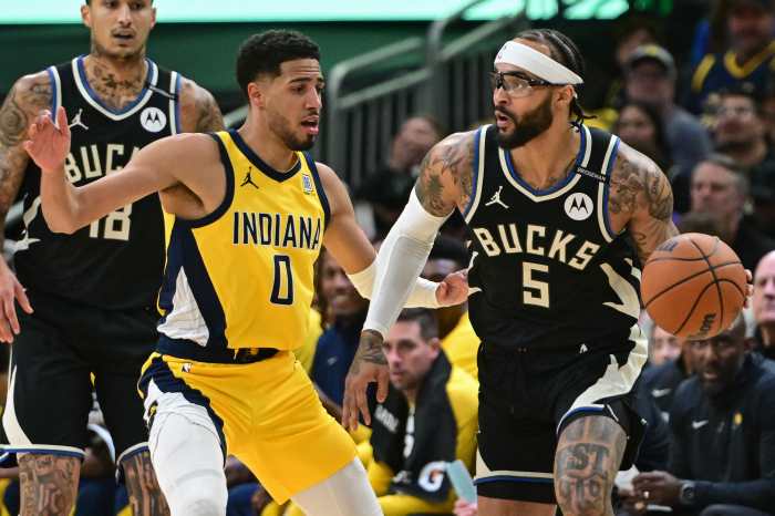Apr 27, 2025; Milwaukee, Wisconsin, USA; Milwaukee Bucks guard Gary Trent Jr. (5) looks for a shot against Indiana Pacers guard Tyrese Haliburton (0) in the first quarter during game four of first round for the 2024 NBA Playoffs at Fiserv Forum. Mandatory Credit: Benny Sieu-Imagn Images