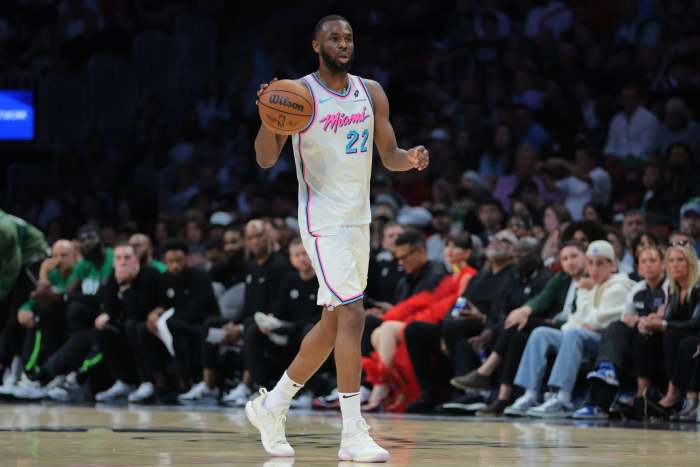 Miami Heat forward Andrew Wiggins (22) dribbles the basketball against the Boston Celtics during the second quarter at Kaseya Center.