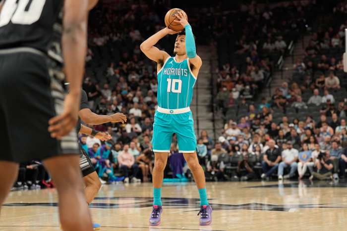 Mar 14, 2025; San Antonio, Texas, USA; Charlotte Hornets guard Josh Green (10) shoots during the first half against the San Antonio Spurs at Frost Bank Center. Mandatory Credit: Scott Wachter-Imagn Images