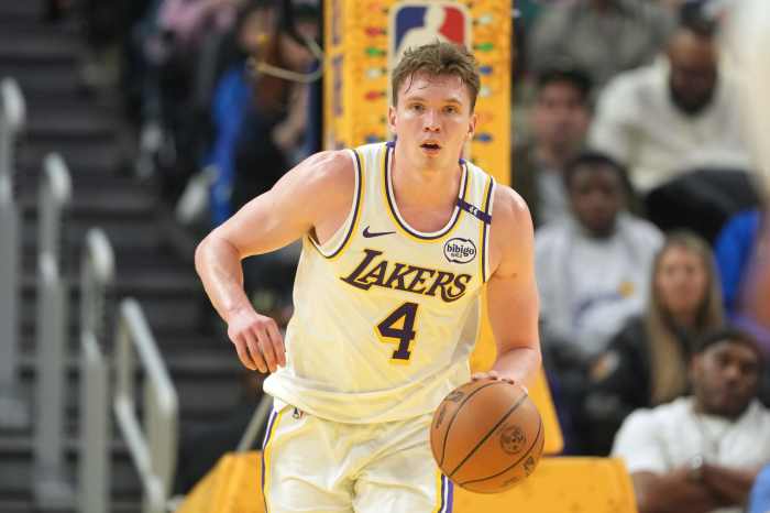 Los Angeles Lakers guard Dalton Knecht (4) dribbles against the Golden State Warriors during the second quarter at Chase Center.