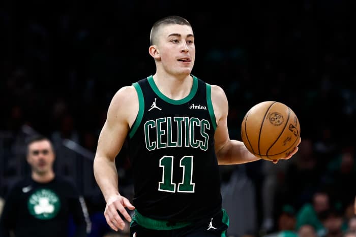 Boston, Massachusetts, USA; Boston Celtics guard Payton Pritchard (11) brings the ball up court against the Miami Heat during the second half at TD Garden. Mandatory Credit: Winslow Townson-Imagn Images