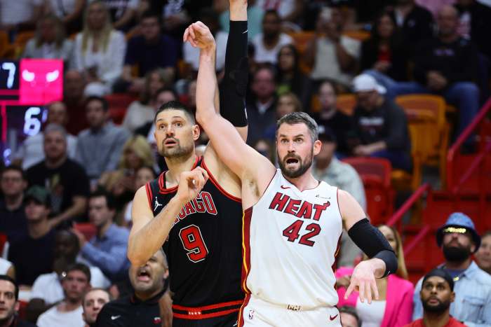 Miami Heat forward Kevin Love (42) watches his shot against Chicago Bulls center Nikola Vucevic (9) in the fourth quarter during a play-in game of the 2024 NBA playoffs at Kaseya Center. Mandatory Credit: Sam Navarro-Imagn Images