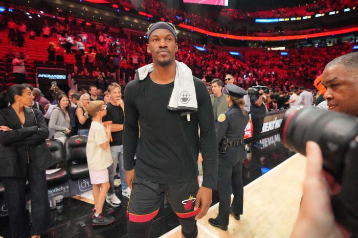 Miami Heat forward Jimmy Butler (22) walks off the court after greeting court-side friends following the victory over the San Antonio Spurs at Kaseya Center.