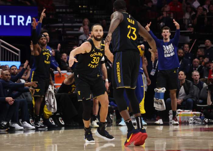 Feb 13, 2025; Houston, Texas, USA; Golden State Warriors forward Draymond Green (23) celebrates with guard Stephen Curry (30) after a basket against the Houston Rockets in the second half at Toyota Center. Mandatory Credit: Thomas Shea-Imagn Images  