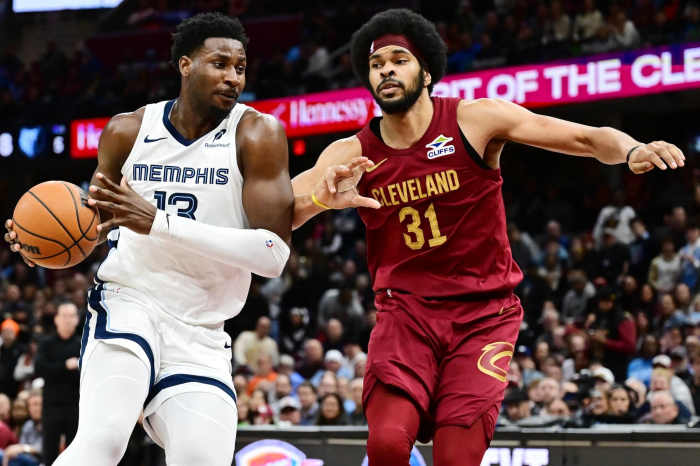 Memphis Grizzlies forward Jaren Jackson Jr. (13) drives to the basket against Cleveland Cavaliers center Jarrett Allen (31) during the second half at Rocket Arena.