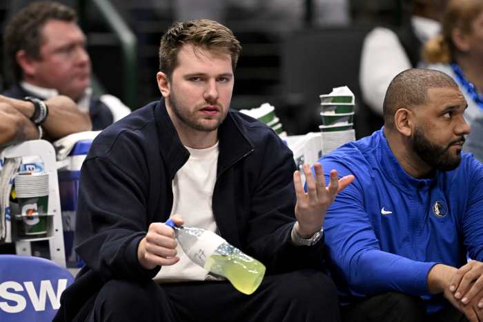 Dallas Mavericks guard Luka Doncic (77) reacts from the team bench during the second half of the game against the Denver Nuggets at the American Airlines Center. Mandatory Credit: Jerome Miron-Imagn Images