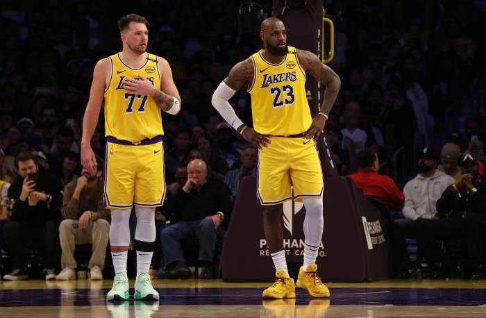 Los Angeles Lakers guard Luka Doncic (77) and forward LeBron James (23) during the second quarter against the Minnesota Timberwolves at Crypto.com Arena.