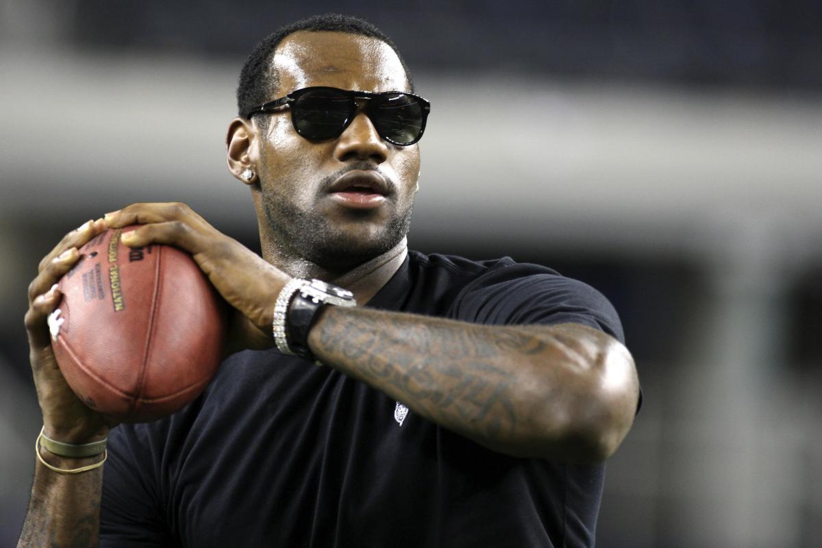 LeBron James getting ready to throw a football