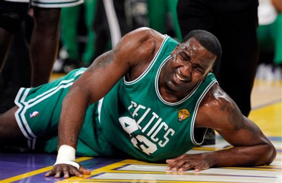 Boston Celtics center Kendrick Perkins lies on the floor after apparently suffering an injury during the first half of Game 6 of the NBA basketball finals against the Los Angeles Lakers on Tuesday, June 15, 2010, in Los Angeles. (AP Photo/Mark J. Terrill)