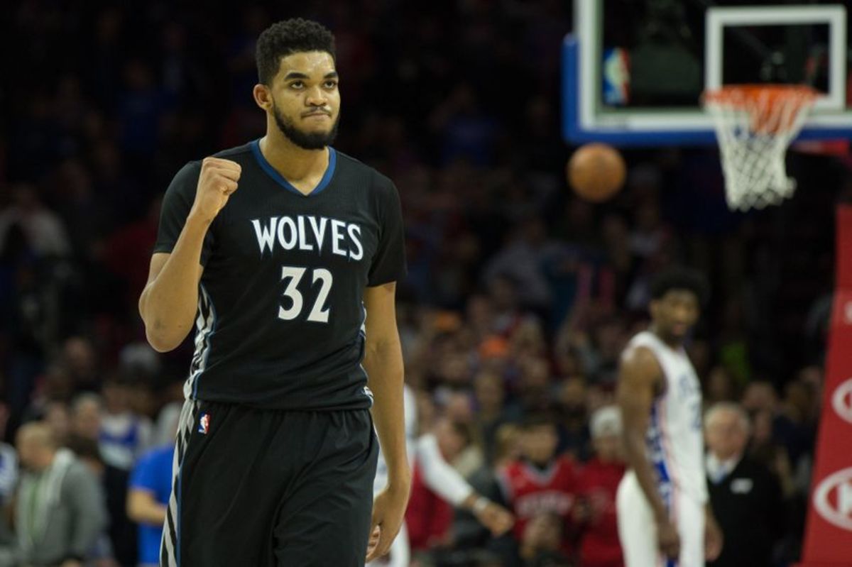 Jan 3, 2017; Philadelphia, PA, USA; Minnesota Timberwolves center Karl-Anthony Towns (32) reacts in front of Philadelphia 76ers center Joel Embiid (21) after a score during the fourth quarter at Wells Fargo Center. The Philadelphia 76ers won 93-91. Mandatory Credit: Bill Streicher-USA TODAY Sports
