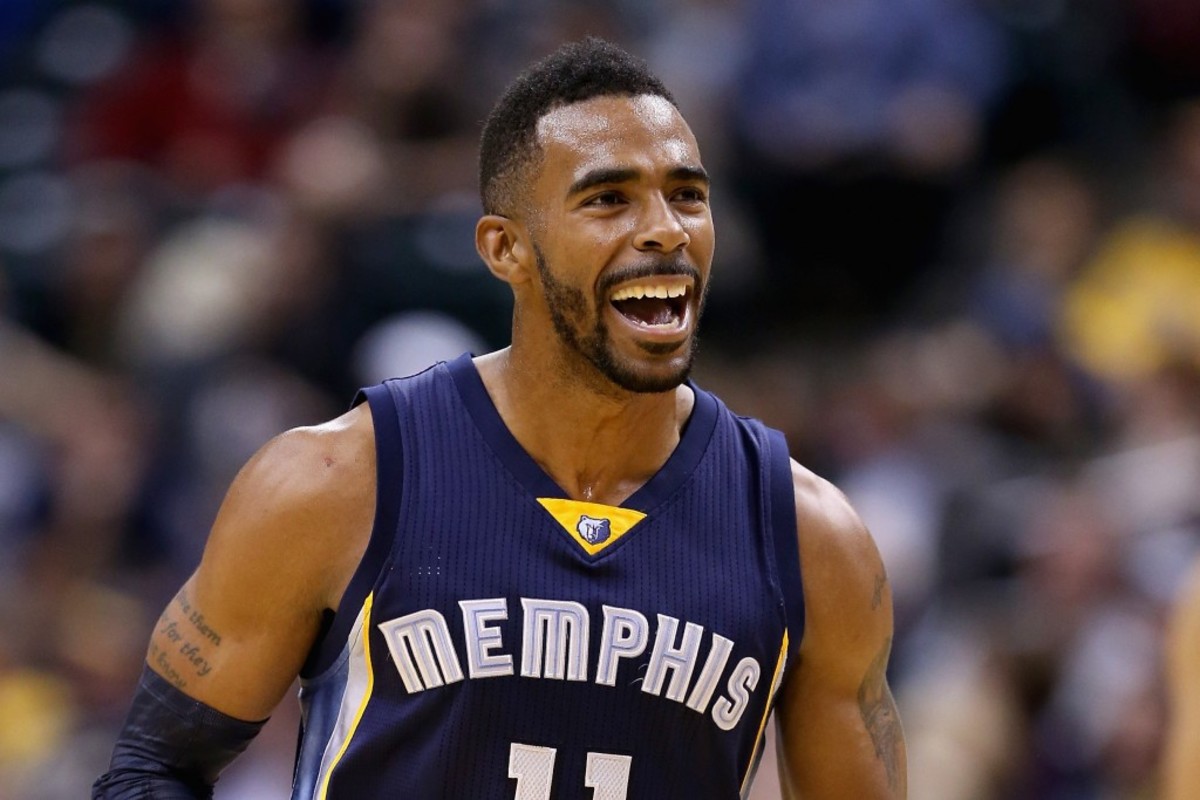 INDIANAPOLIS, IN - OCTOBER 31: Mike Conley #11 of the Memphis Grizzlies celebrates during the game against the Indiana Pacers at Bankers Life Fieldhouse on October 31, 2014 in Indianapolis, Indiana.NOTE TO USER: User expressly acknowledges and agrees that, by downloading and or using this Photograph, user is consenting to the terms and conditions of the Getty Images License Agreement. Mandatory Copyright Notice:   Andy Lyons/Getty Images/AFP