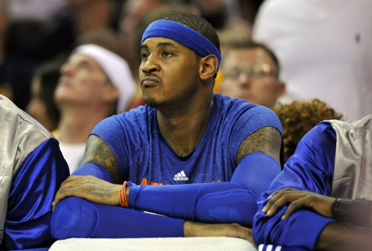Oct 30, 2014; Cleveland, OH, USA; New York Knicks forward Carmelo Anthony (7) reacts on the bench against the Cleveland Cavaliers at Quicken Loans Arena. New York won 95-90. Mandatory Credit: David Richard-USA TODAY Sports