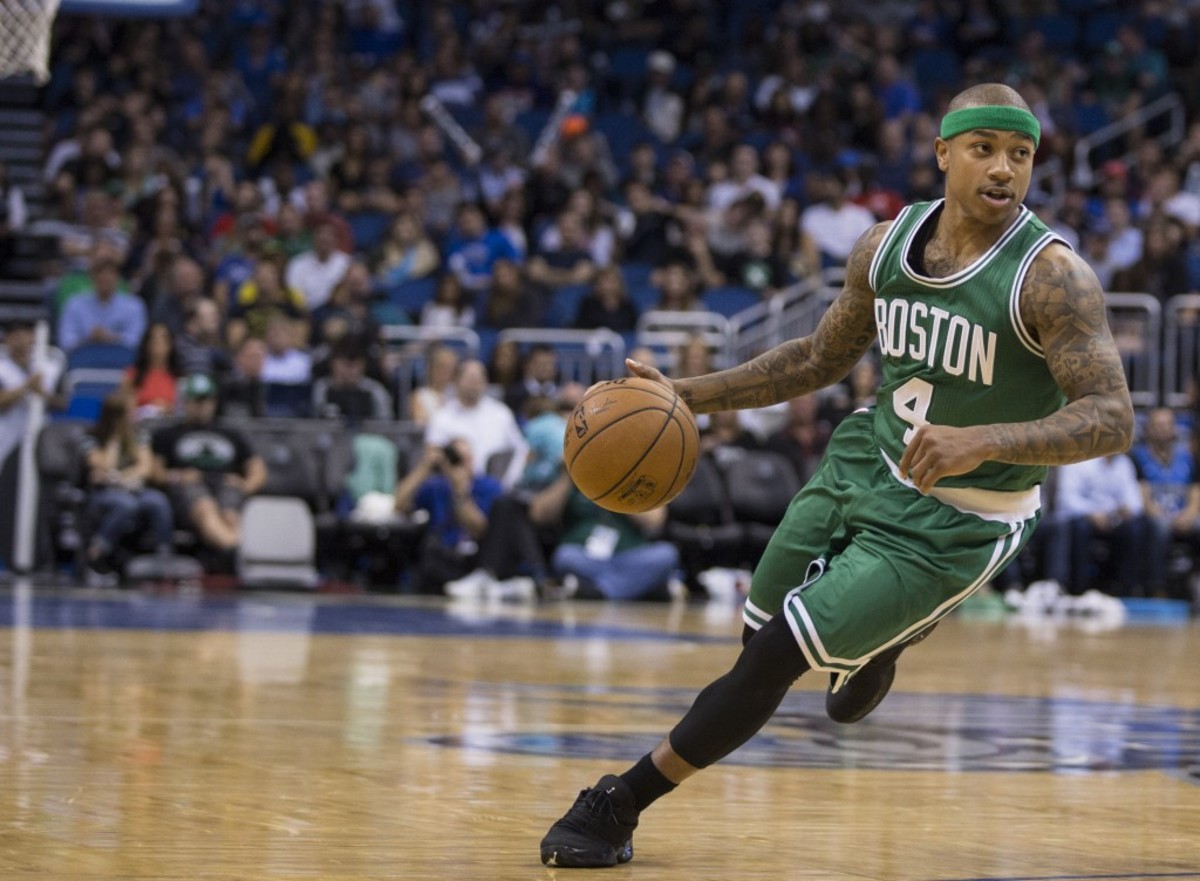Boston Celtics guard Isaiah Thomas (4) dribbles down court against the Orlando Magic during the first half of an NBA basketball game in Orlando, Fla., Sunday, March 8, 2015. (AP Photo/Willie J. Allen Jr.)