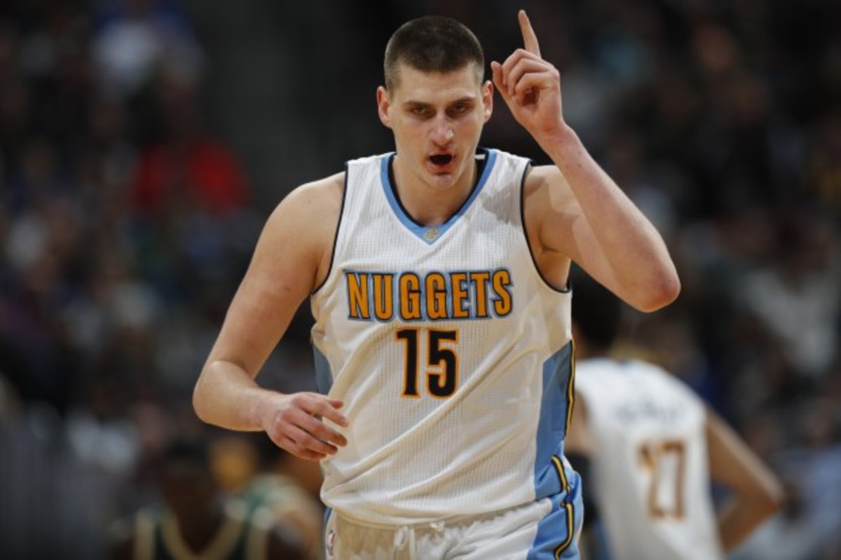 Denver Nuggets forward Nikola Jokic, of Serbia, gestures after hitting a key basket as he drops back on defense against the Milwaukee Bucks late in the second half of an NBA basketball game Friday, Feb. 3, 2017, in Denver. The Nuggets won 121-117. (AP Photo/David Zalubowski)