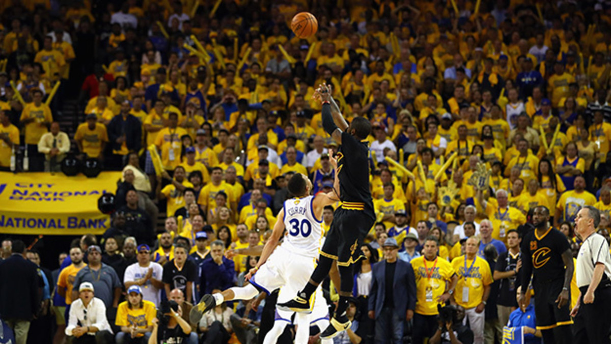 OAKLAND, CA - JUNE 19:  Kyrie Irving #2 of the Cleveland Cavaliers shoots a three-point basket late in the fourth quarter against Stephen Curry #30 of the Golden State Warriors in Game 7 of the 2016 NBA Finals at ORACLE Arena on June 19, 2016 in Oakland, California. NOTE TO USER: User expressly acknowledges and agrees that, by downloading and or using this photograph, User is consenting to the terms and conditions of the Getty Images License Agreement.  (Photo by Ezra Shaw/Getty Images)