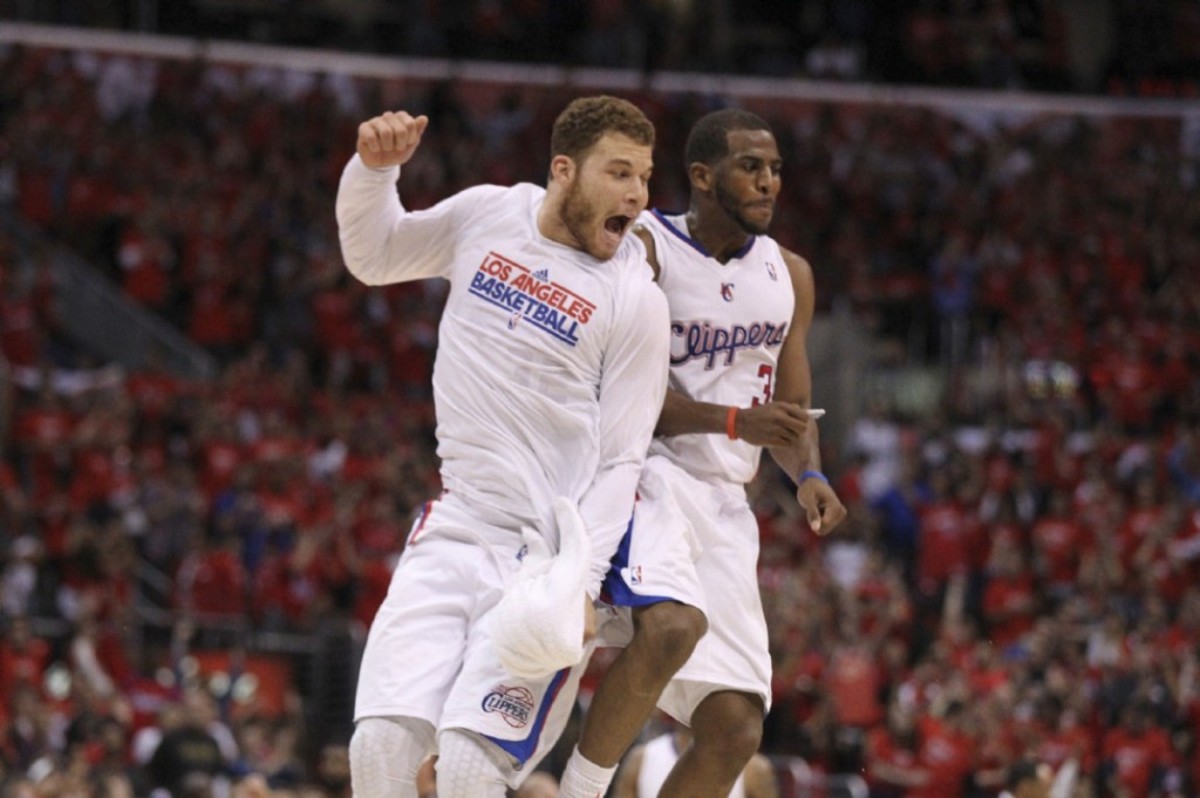 Los Angeles Clippers' Blake Griffin, left, and Chris Paul celebrate a basket during overtime in a NBA first-round playoff basketball game against the Memphis Grizzlies in Los Angeles, Monday, May 7, 2012. The Clippers won 101-97 in overtime.(AP Photo/Chris Carlson)