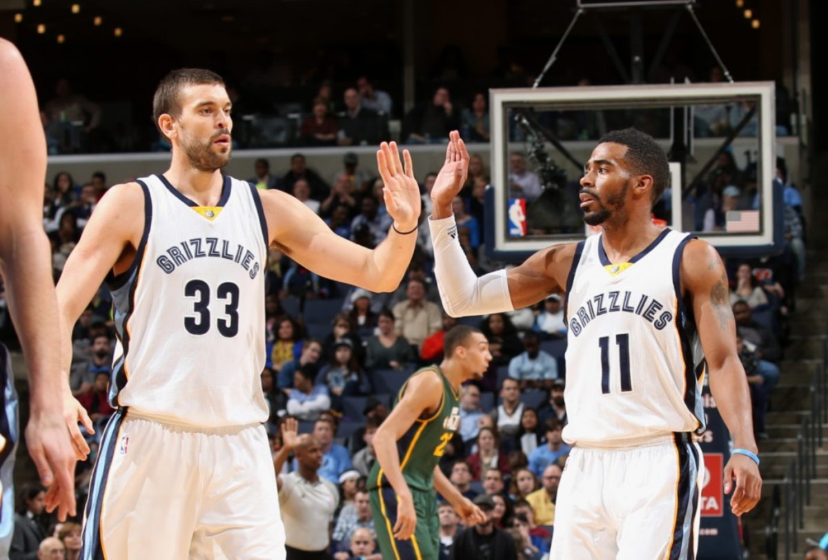 MEMPHIS, TN - DECEMBER 22: Marc Gasol #33 and Mike Conley #11 of the Memphis Grizzlies celebrate during a game against the Utah Jazz on December 22, 2014 at FedExForum in Memphis, Tennessee. NOTE TO USER: User expressly acknowledges and agrees that, by downloading and or using this photograph, User is consenting to the terms and conditions of the Getty Images License Agreement. Mandatory Copyright Notice: Copyright 2014 NBAE (Photo by Joe Murphy/NBAE via Getty Images)
