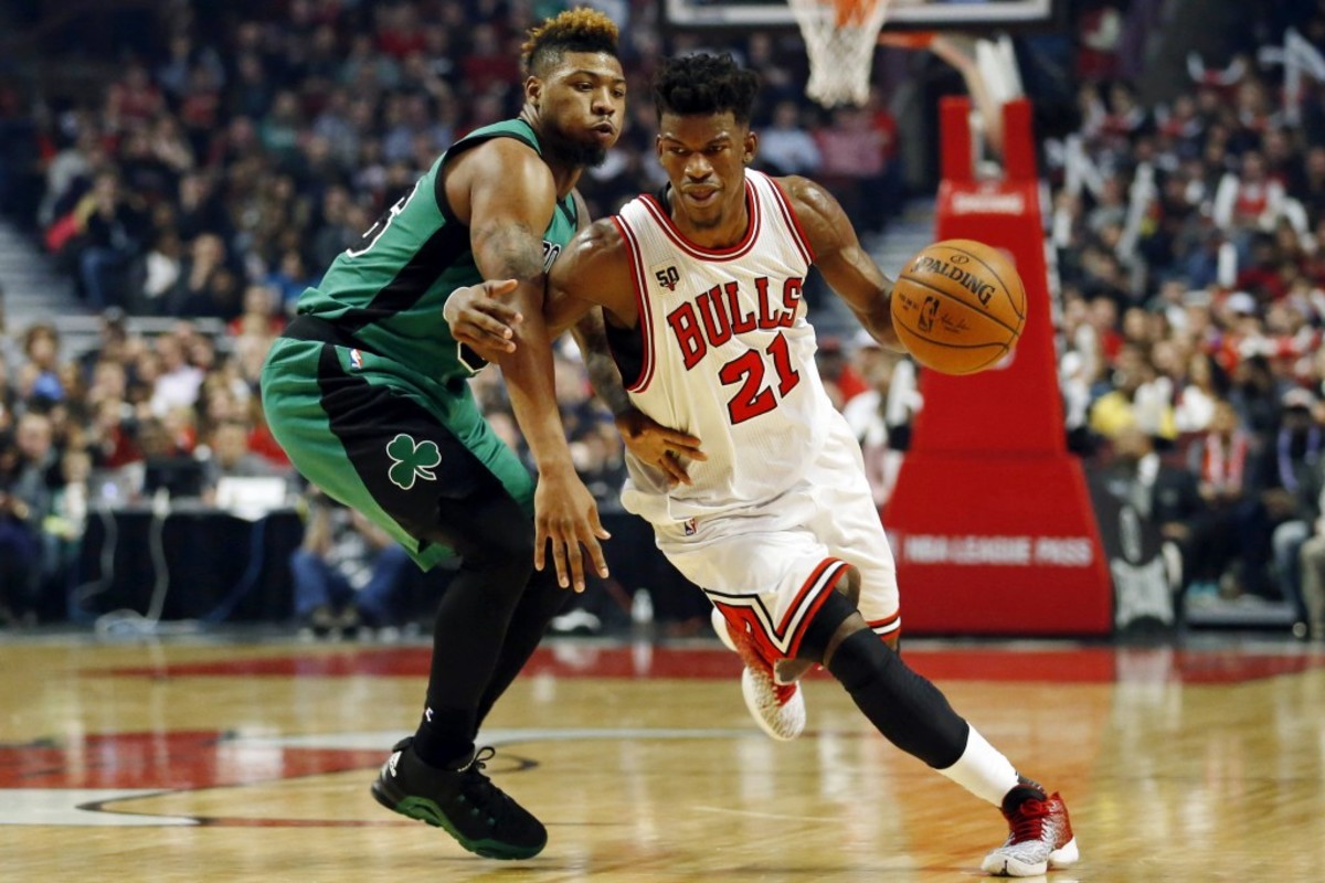 Jan 7, 2016; Chicago, IL, USA; Chicago Bulls guard Jimmy Butler (21) drives to the basket against Boston Celtics guard Marcus Smart (36) during the second half at United Center. The Bulls won 101-92. Mandatory Credit: Kamil Krzaczynski-USA TODAY Sports