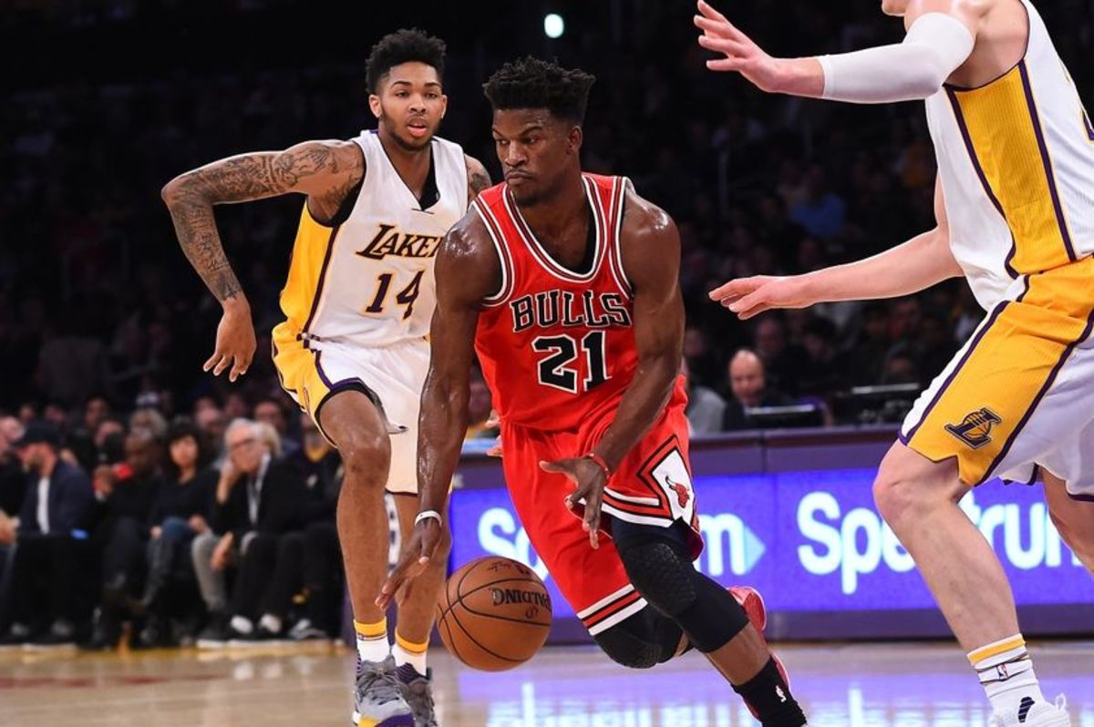 Nov 20, 2016; Los Angeles, CA, USA;  Chicago Bulls forward Jimmy Butler (21) dribbles the ball past past Los Angeles Lakers forward Brandon Ingram (14) in the first quarter of the game at Staples Center. Mandatory Credit: Jayne Kamin-Oncea-USA TODAY Sports